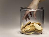 Hand reaching into cookie jar