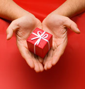 Hands holding small gift