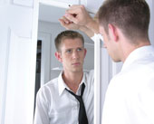 Man looking into mirror